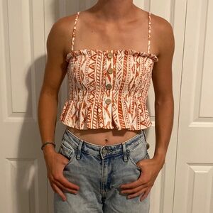Red and white patterned ruffle crop top